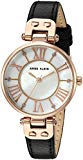 Watch Sizing Guide
This darling Anne Klein™ watch exudes a kind of class and beauty one never tires of seeing on their wrist.
Rose gold-tone metal case.
Black leather band features an adjustable buckle closure.
Round face.
Three-hand analog display ...